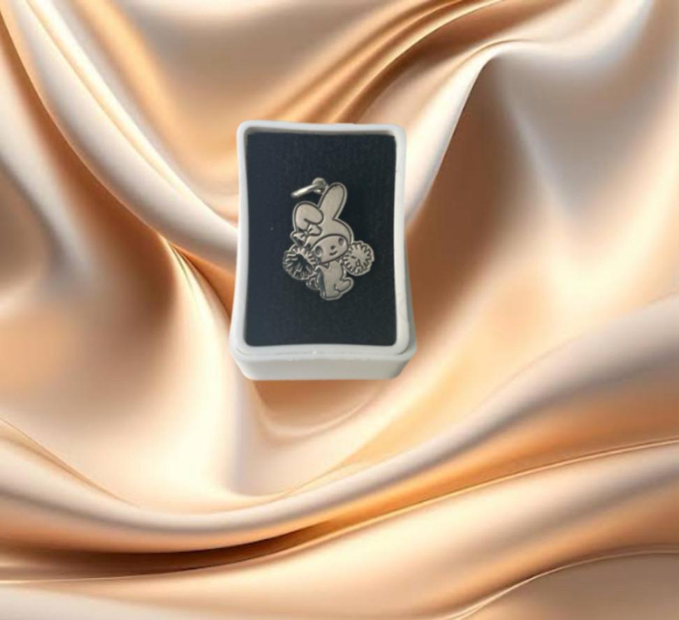 DIJE MELODY CON POMMPONES